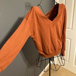 Tan/brown shoulder or deep v sweater